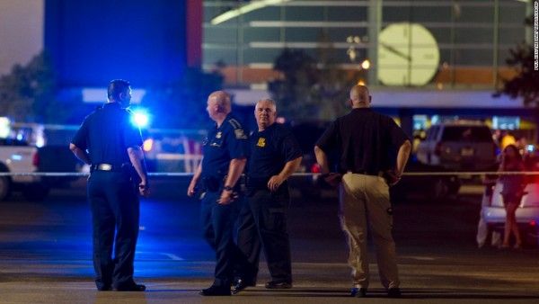 Police officers responding to Lafayette, LA movie theater shooting.