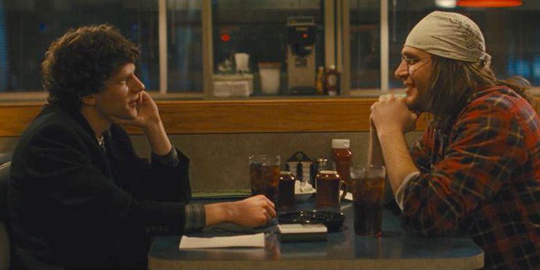 Jesse Eisenberg and Jason Segel sitting across from each other at a diner in &lsquo;The End of the Tour&rsquo;