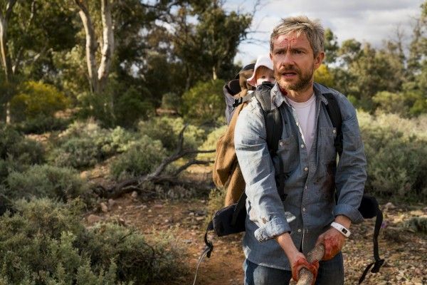 Martin Freeman with backpack in woods in Cargo
