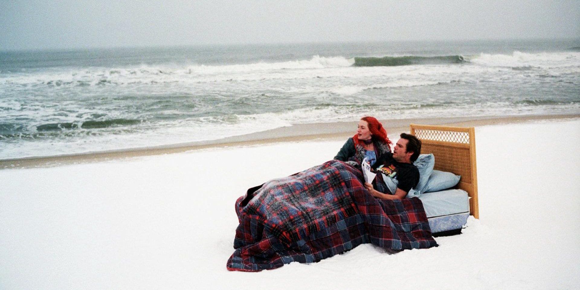 A couple in bed together at the beach