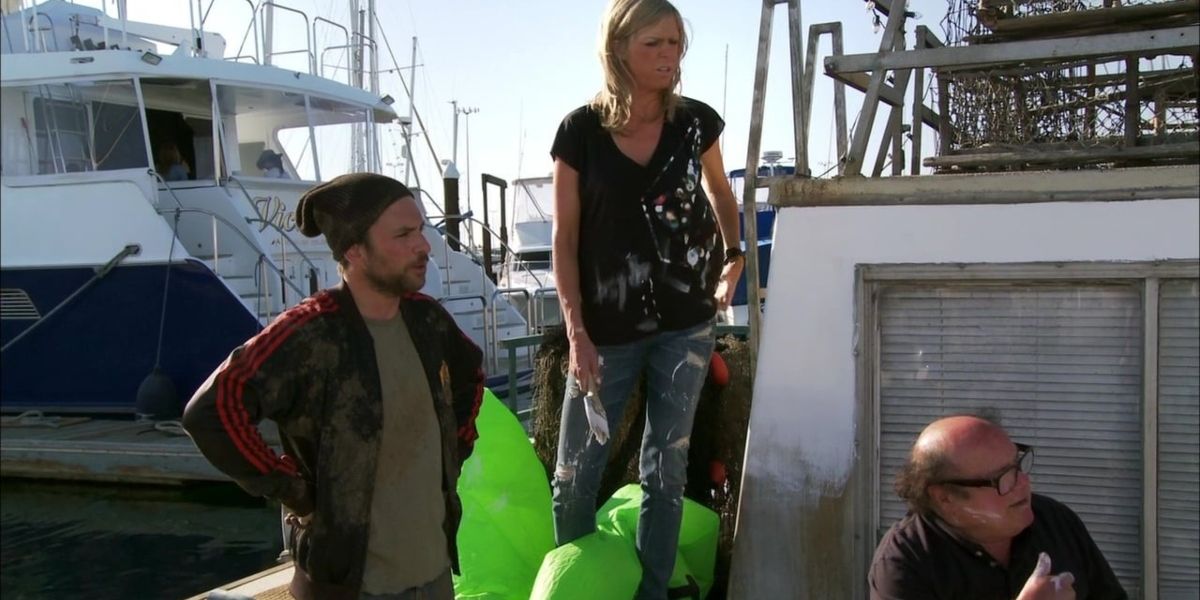 Charlie and Dee standing on a boat in It's Always Sunny