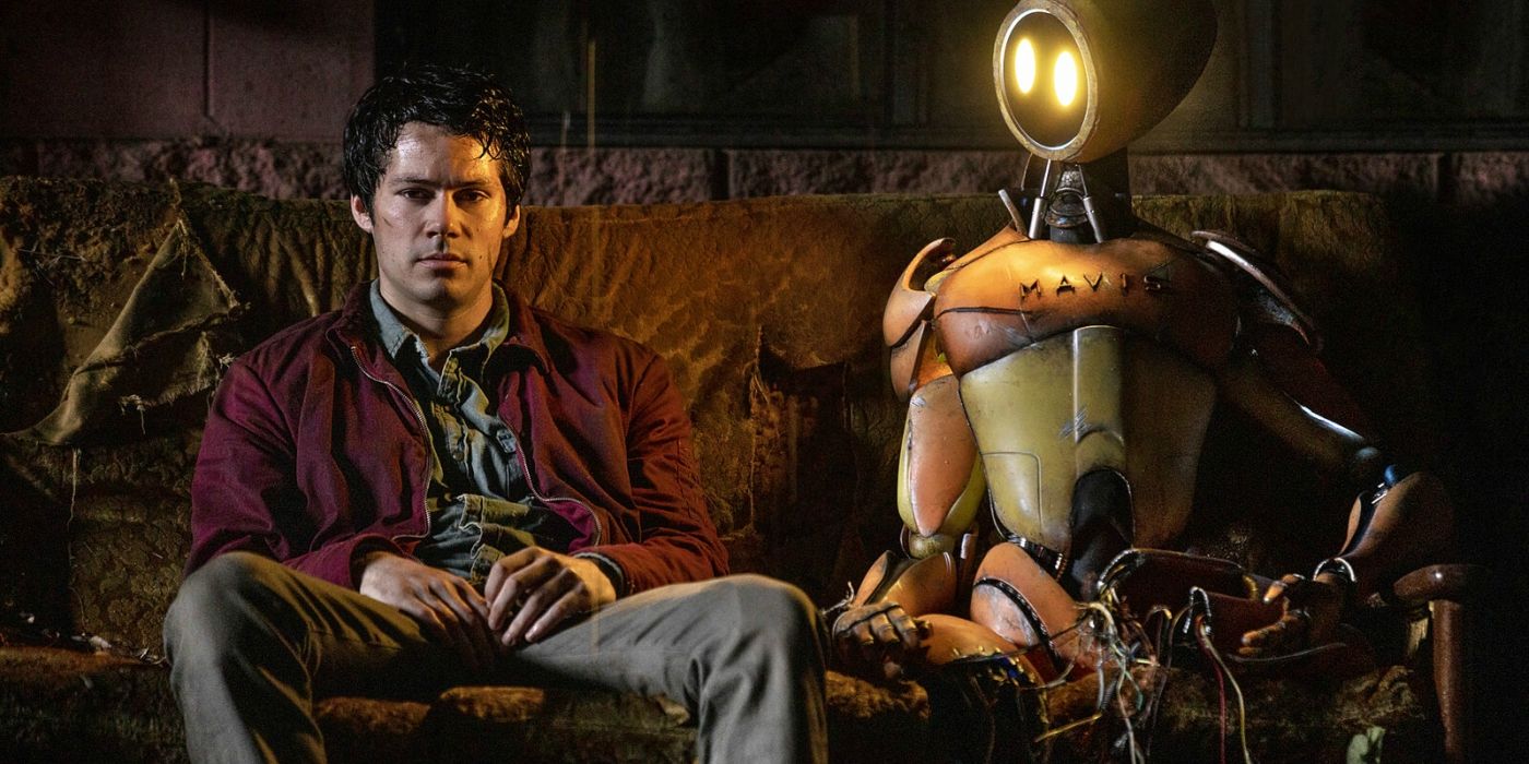 Joel sits next to the robot in Love and Monsters
