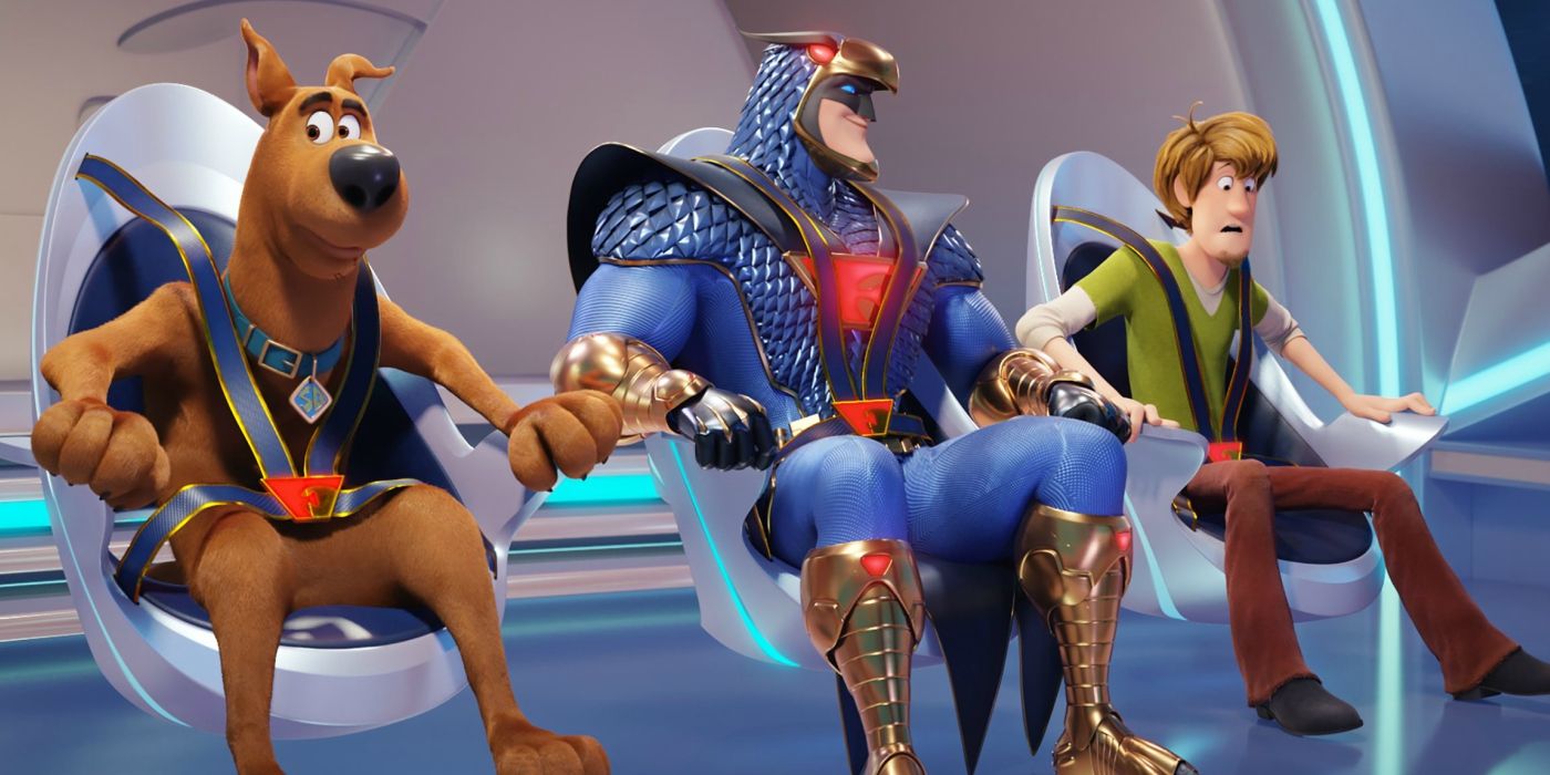 Shaggy and Scooby strapped into chairs next to superhero The Blue Falcon in 'Scoob'