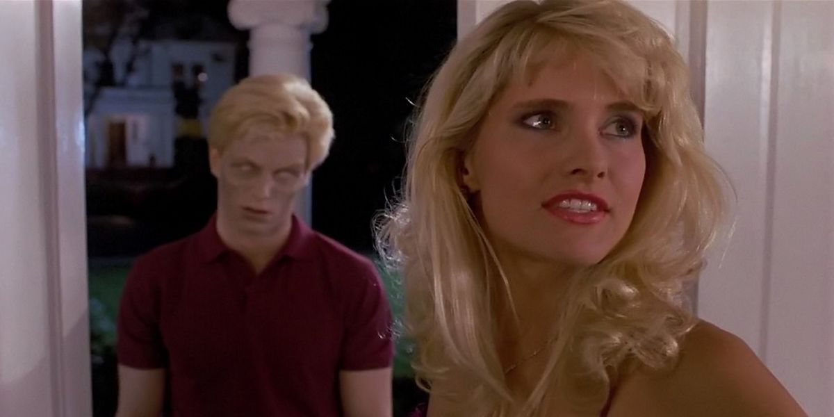A young woman opens a door to find a zombie in Night of the Creeps