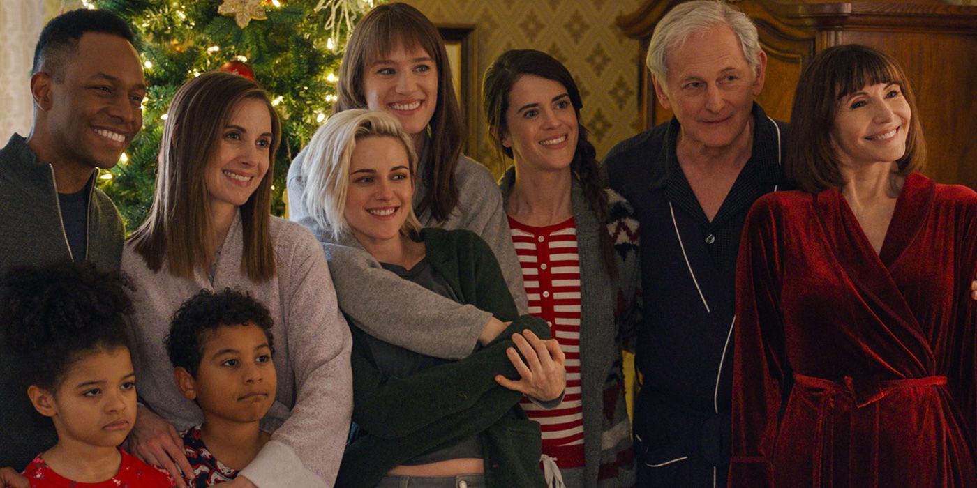 The Caldwell family poses for a Christmas family photo with Harper wrapping her arms around Abby in 'Happiest Season' (2020)
