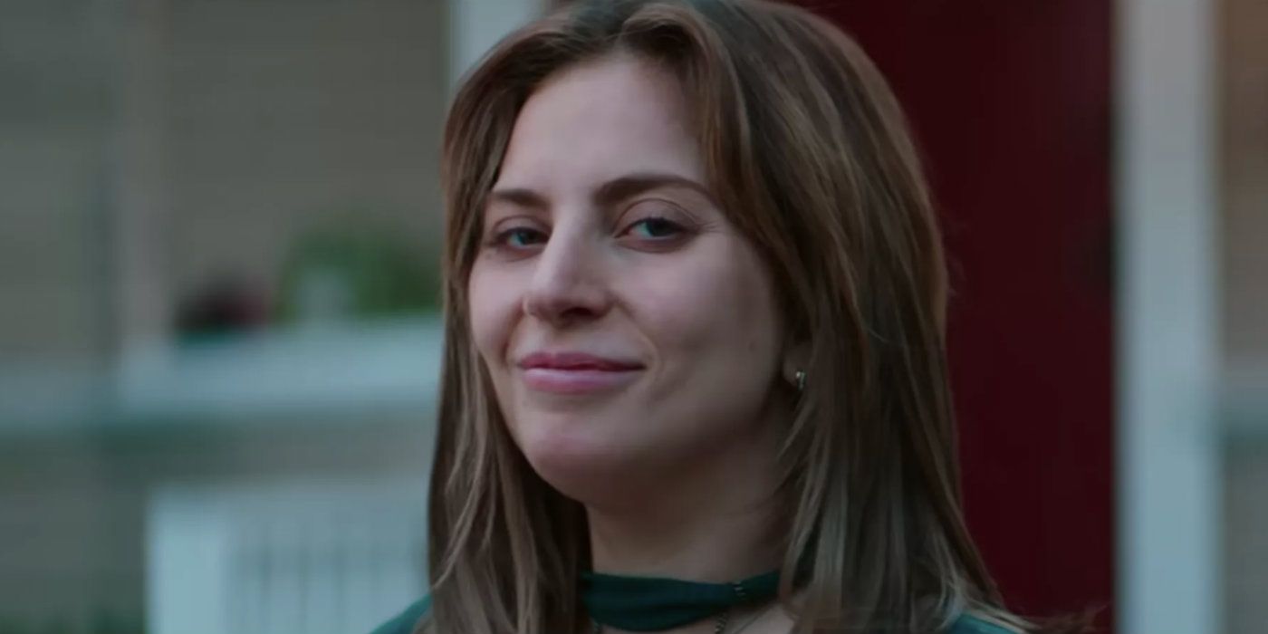 Ally smiling at the camera in A Star Is Born