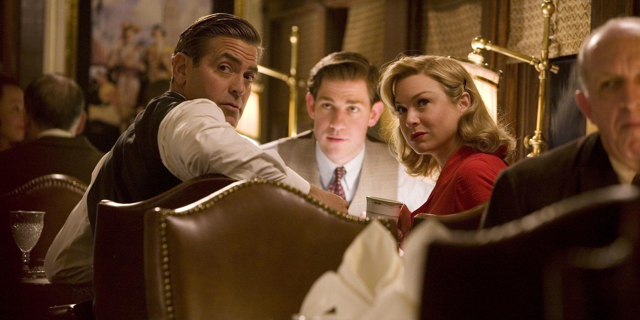 Two men and a woman sit in a 1920s restaurant booth peering over their shoulders.