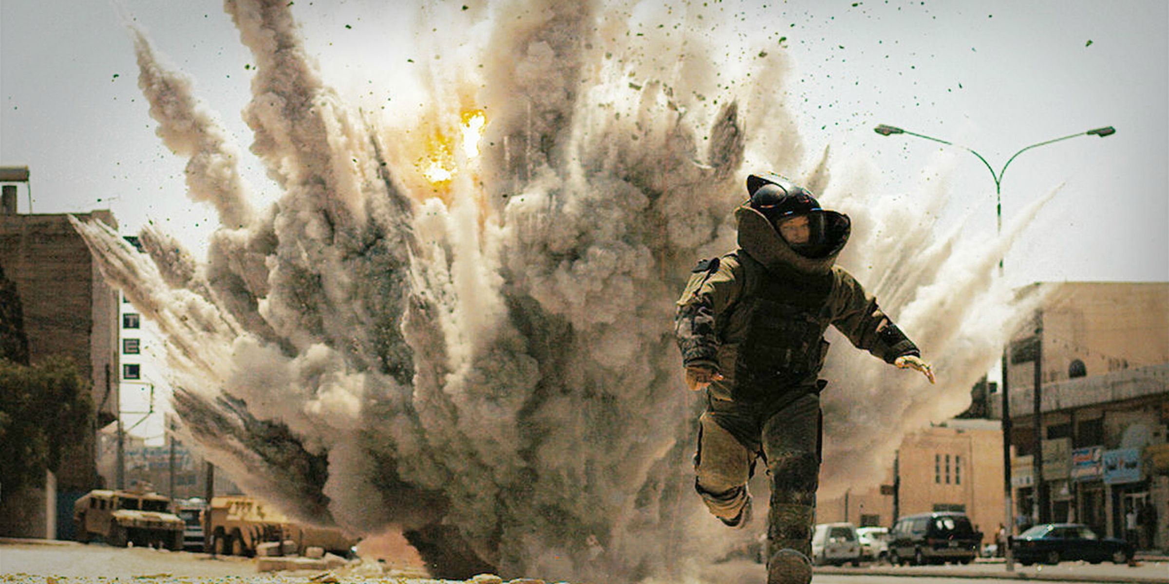 A soldier running away from an explosion in The Hurt Locker