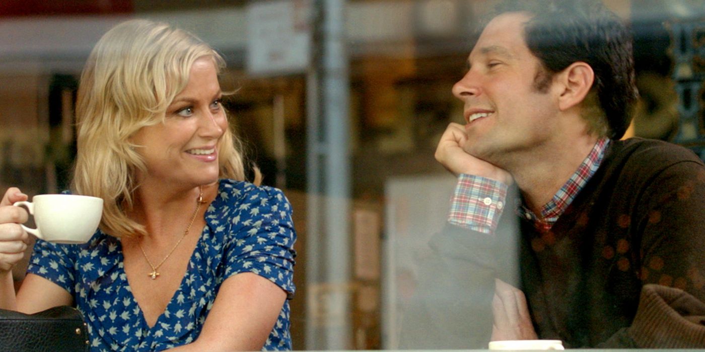 Molly and Joel chatting at a coffee house in They Came Together