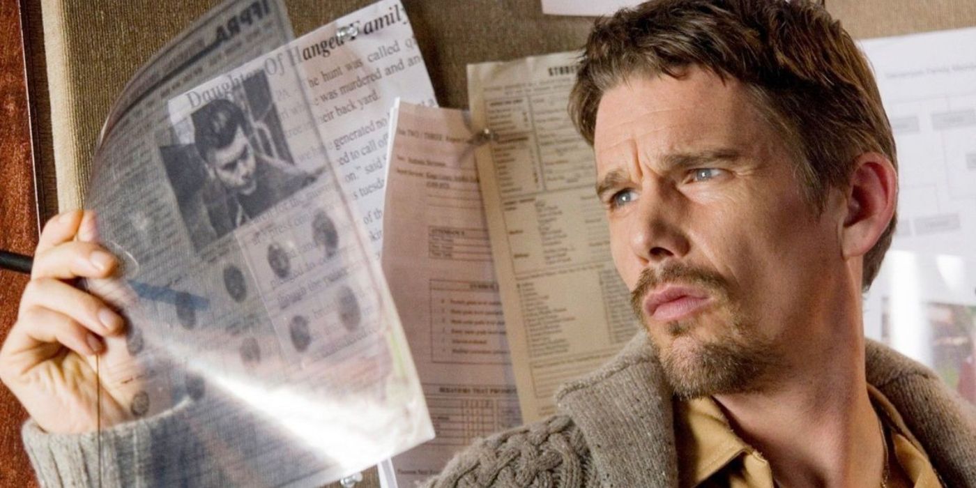 Ethan Hawke as Ellison looking at a document in Insidious.