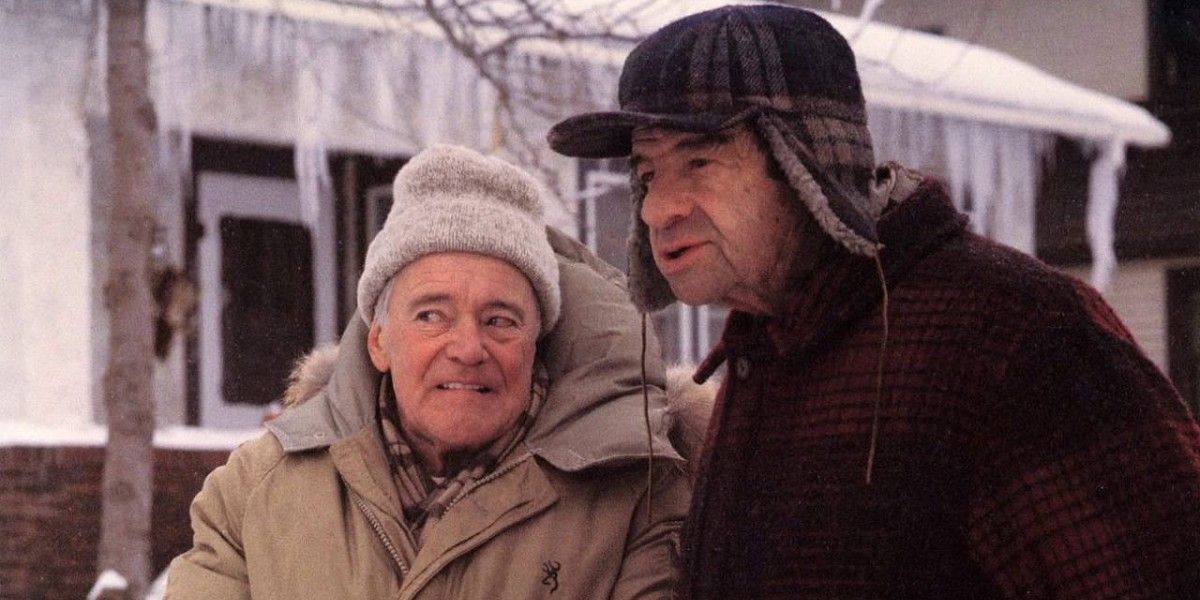 Two older men standing outside in the movie 