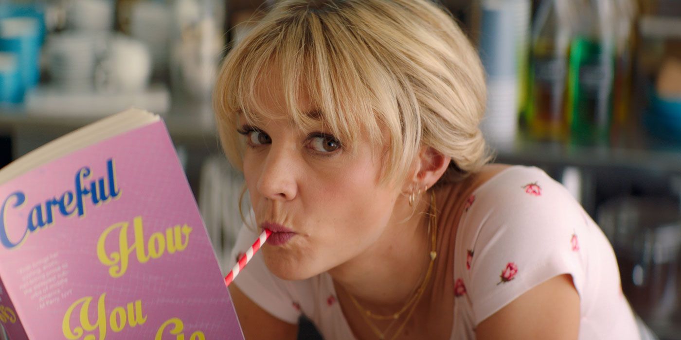 Cassie (Carey Mulligan) sipping from a straw while reading a book in Promising Young Woman