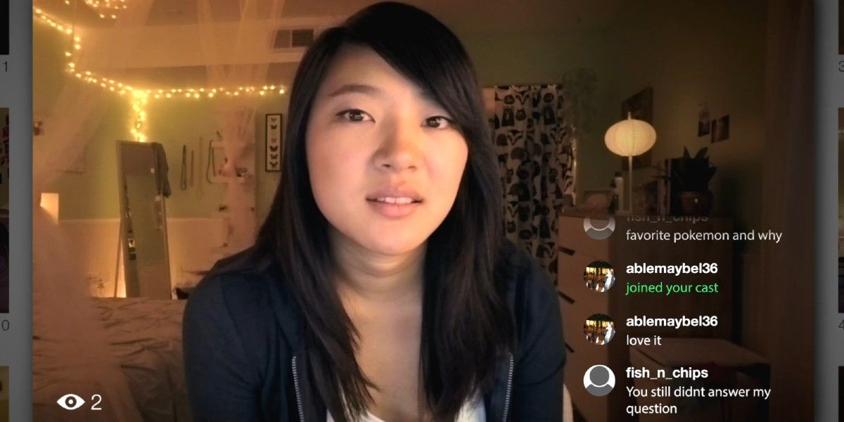 A teenage girl live streaming with a chat bar on the side