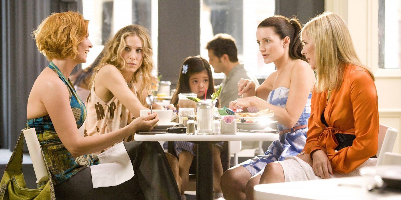 Carrie, Miranda, Charlotte, Samantha, and Lily at brunch together in the Sex and the City movie