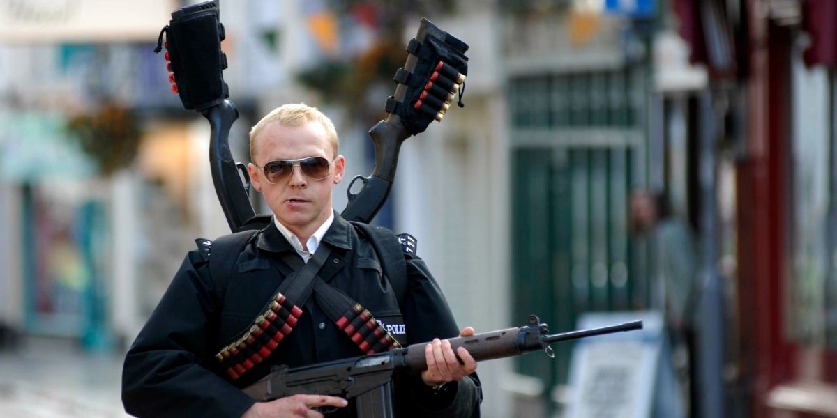 Simon Pegg armed with many guns in Hot Fuzz