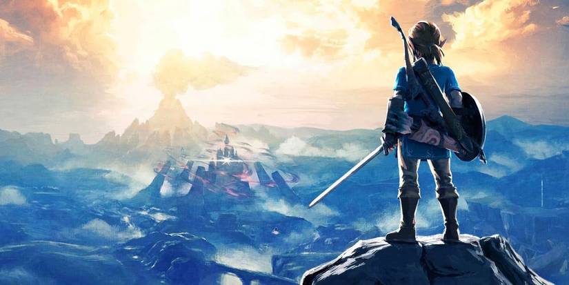Link looking to the distance from atop a mountain in The Legend of Zelda: Breath of the Wild