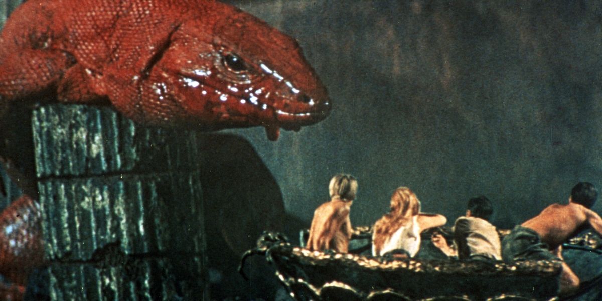 A giant monster chases after a group of humans escaping in a boat in Journey to the Center of the Earth
