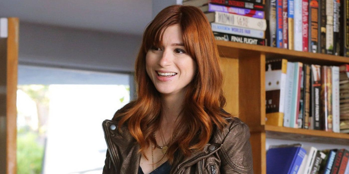 Aya Cash smiling in a library on You're the Worst