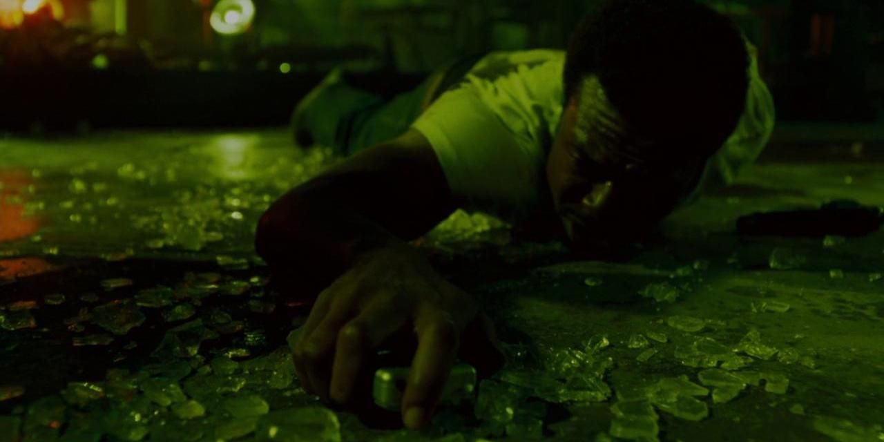 Lyriq Bent crawling along a glass-covered floor in Saw IV