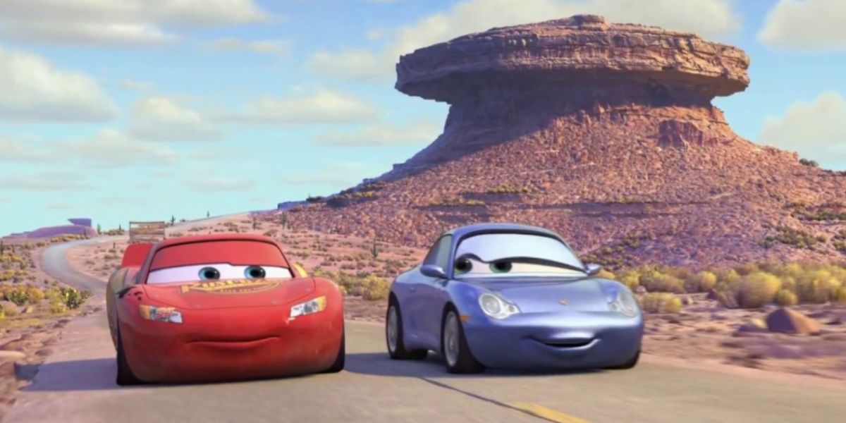 Lightning McQueen drives along a desert road with his romantic interest Sally Carrera in 'Cars'