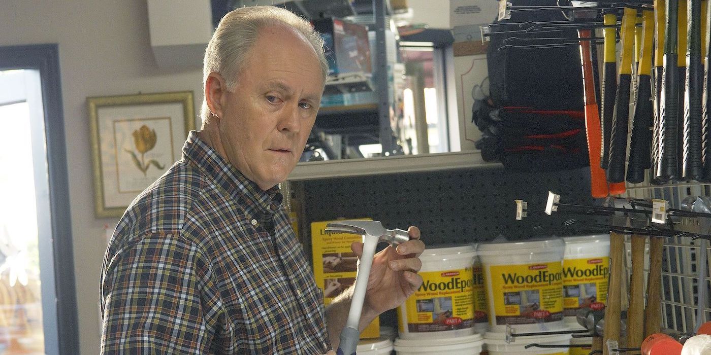 Trinity Killer from Dexter in a hardware store holding a hammer and looking suspicious.