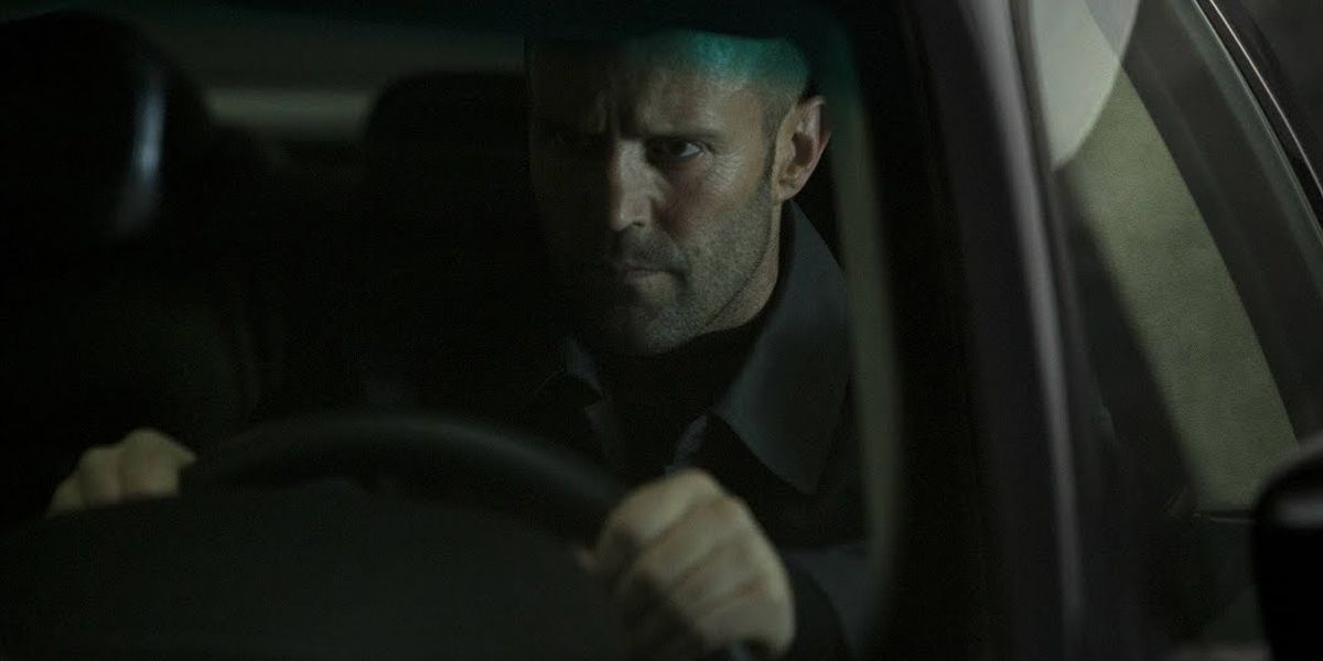 Jason Statham as Deckard Shaw driving a car in Furious 7.