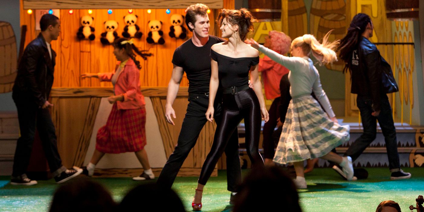 Ryder and Marley performing as Danny and Sandy on stage in Glee