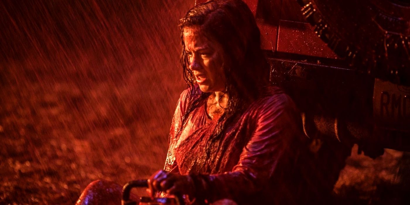 Mia covered in blood and looking pensive in Evil Dead.