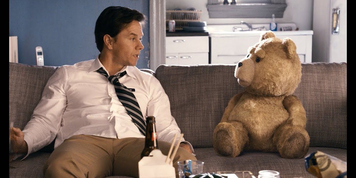 Mark Wahlberg and Seth MacFarlane sit on a couch in Ted