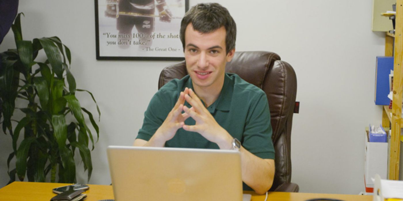 Nathan Fielder sitting at a laptop in Nathan for You