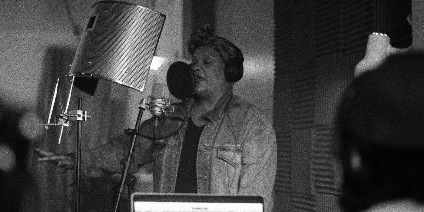 A woman in a recording studio