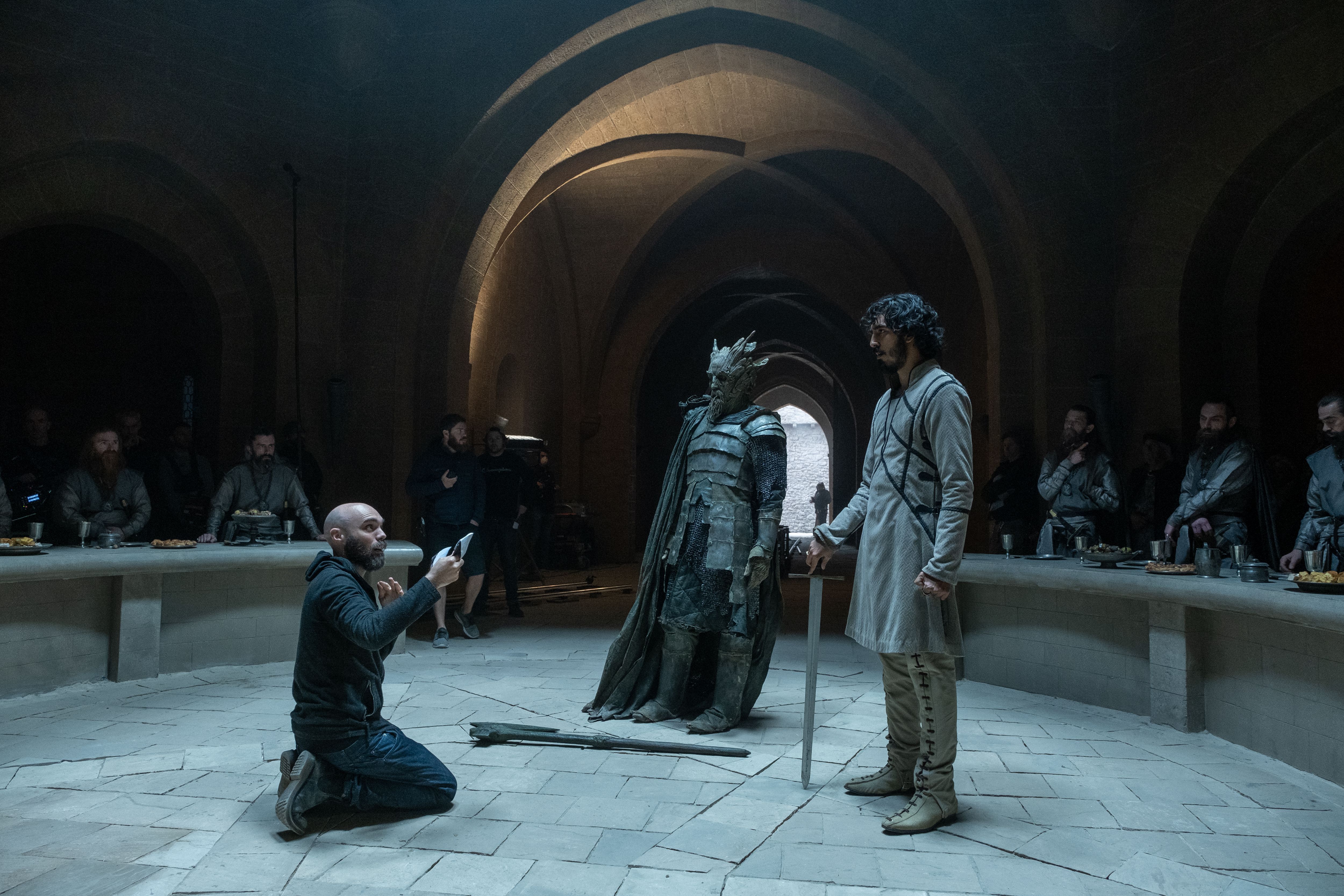 David Lowery and Dev Patel on the set of The Green Knight