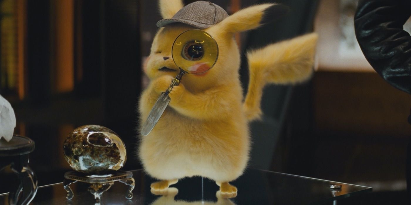 Pikachu with a magnifying glass against his eye in Detective Pikachu