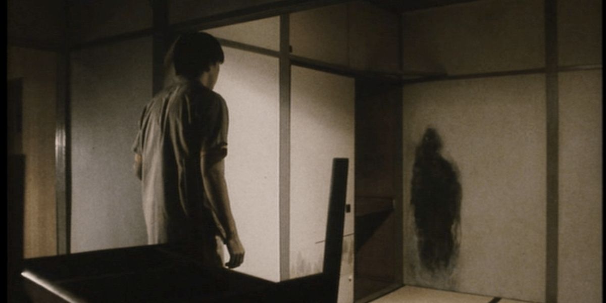 Image from &lsquo;Pulse&rsquo; of a man looking at a human-shaped shadow on a wall.
