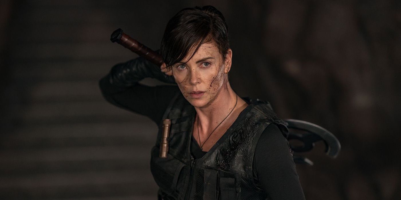Charlize Theron as Andy about to wield her sword in The Old Guard.