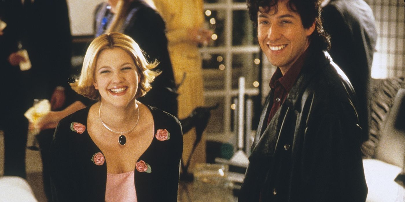 Drew Barrymore as Julia and Adam Sandler as Robbie smiling in 'The Wedding Singer.'