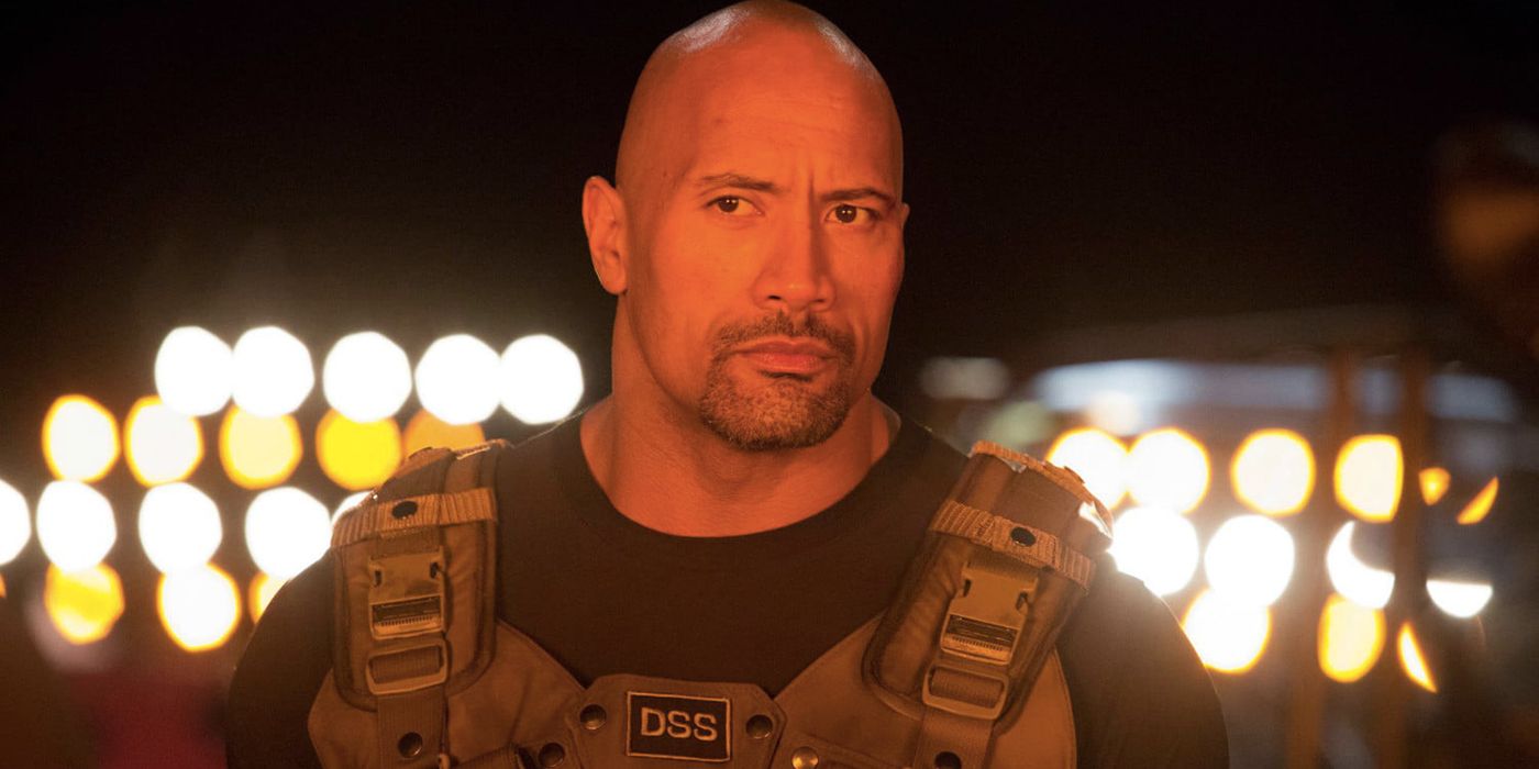 Luke Hobbs looking at something with a distrustful expression in Hobbs & Shaw.