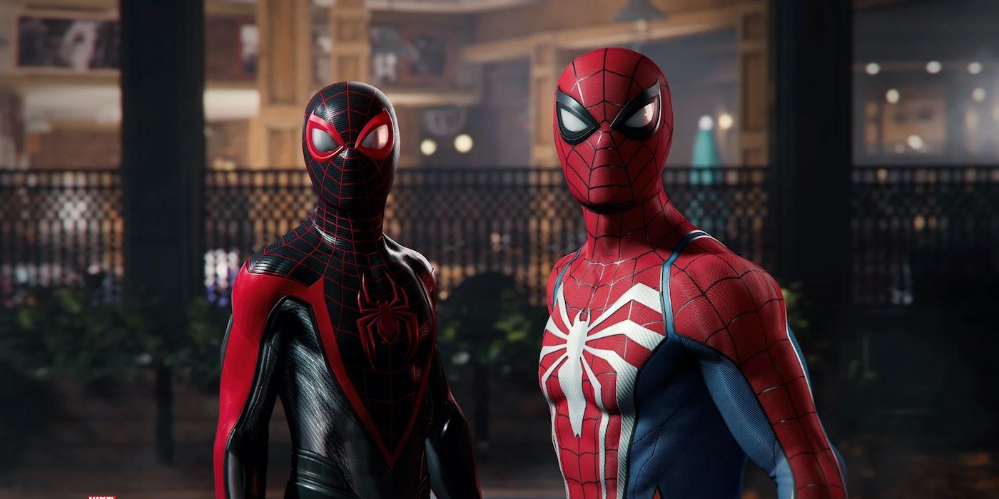 Miles and Peter standing next to each other and looking in the same direction in Marvel's Spider-Man 2.