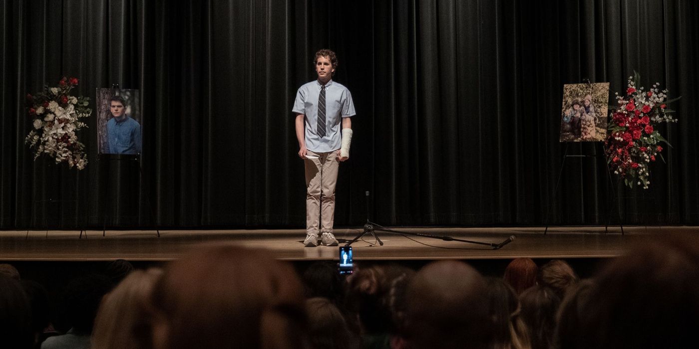 Evan Hansen speaking on stage in Dear Evan Hansen.