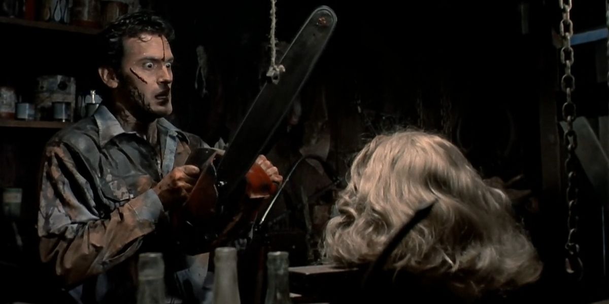 Ash holding a chainsaw over his girlfriend's severed head in Evil Dead 2