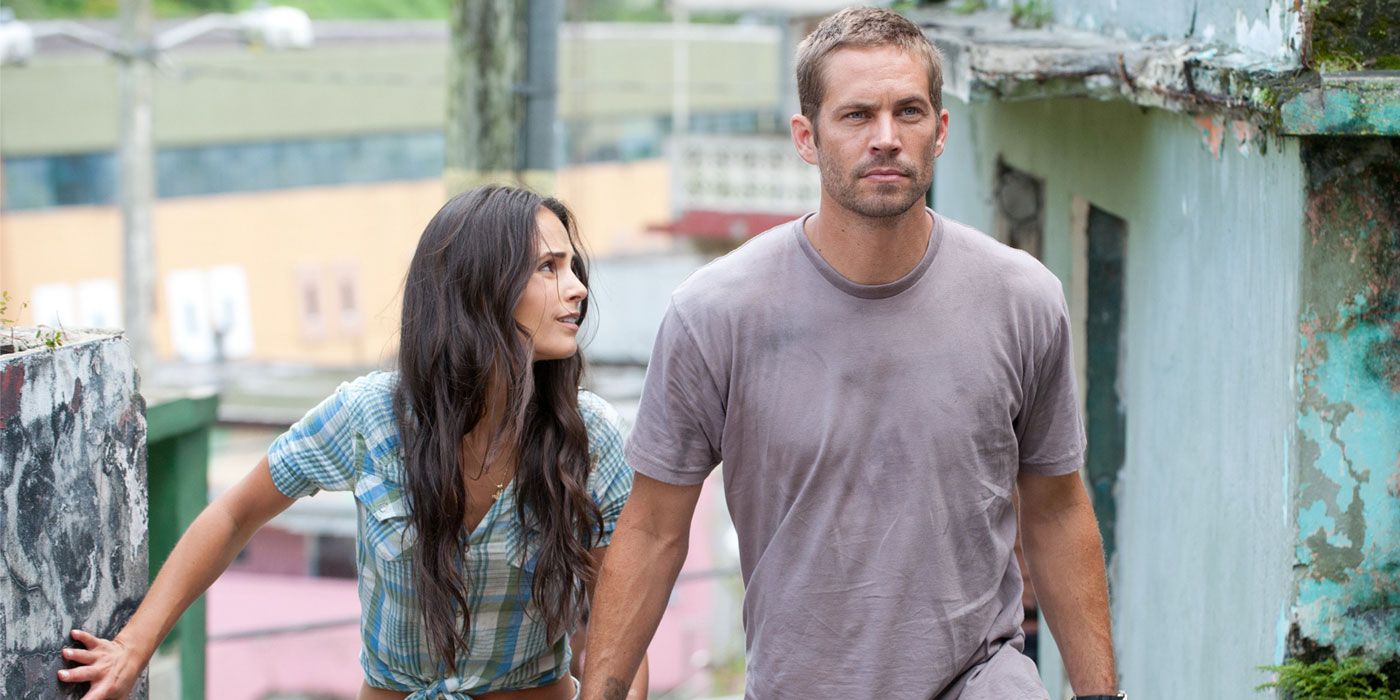 Jordana Brewster and Paul Walker in Fast Five.