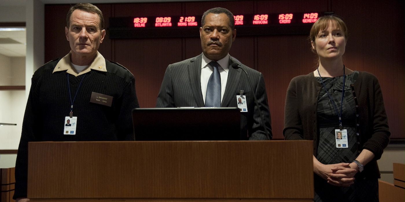 Bryan Cranston, Laurence Fishburne, and Jennifer Ehle standing together in Contagion