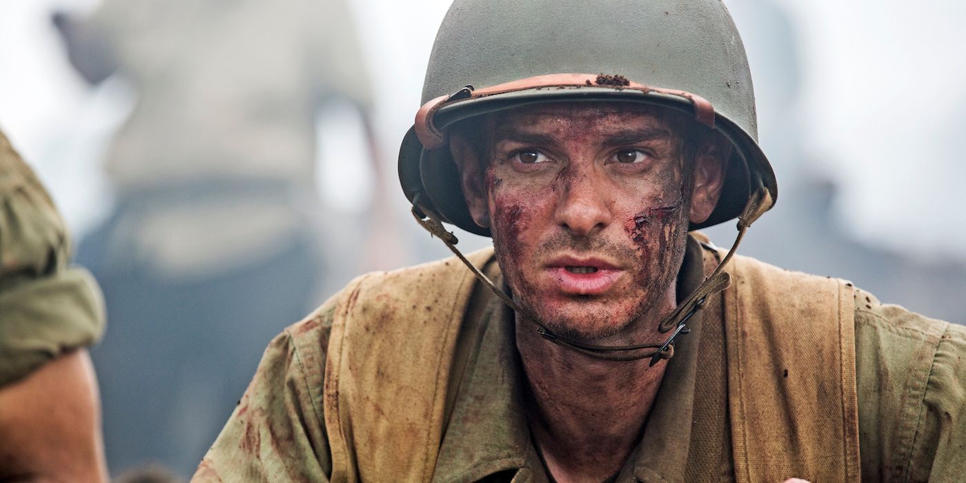 Doss looking over a ledge and looking dirty in Hacksaw Ridge