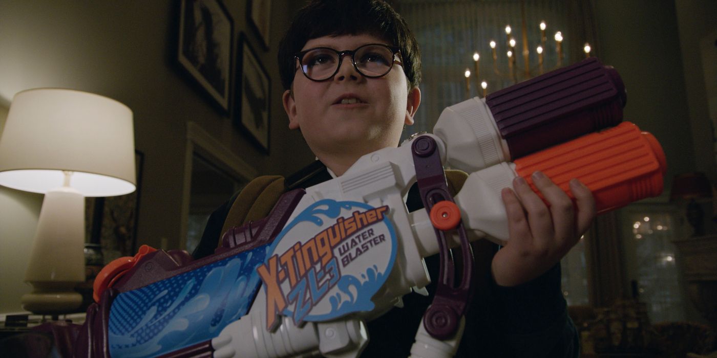Archie Yates as Max Mercer holding a toy gun in Home Sweet Home Alone
