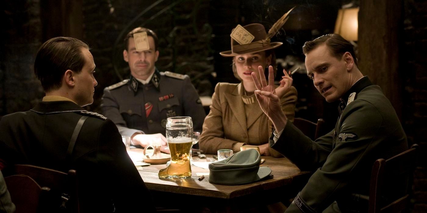 Michael Fassbender holds up three fingers while ordering drinks in a tavern in Inglourious Basterds?