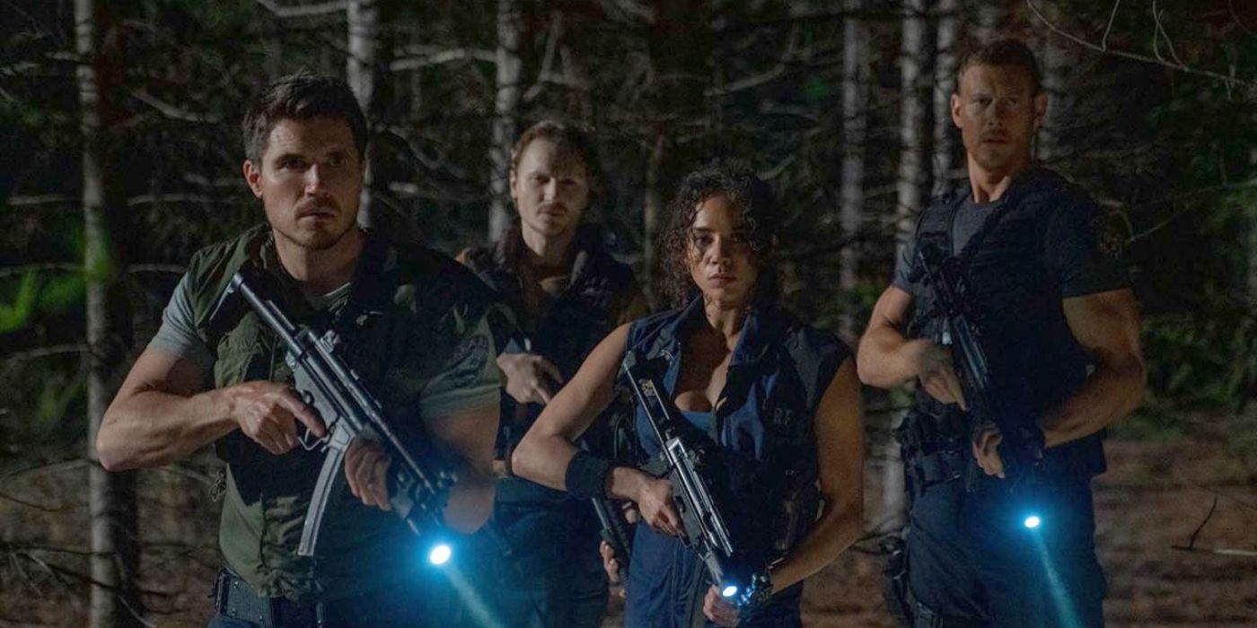 Chris, Joseph, Jill, and Wesker holding guns in the forest in Resident Evil: Welcome to Raccoon City