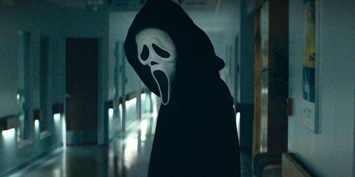 Ghostface standing in an empty hospital hallway in Scream
