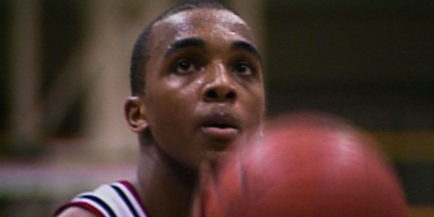 A young boy about to shoot a basketball in Hoop Dreams