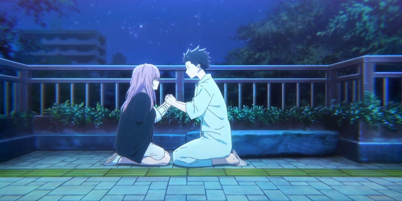 A couple kneeling on the ground and holding each other's hands in A Silent Voice