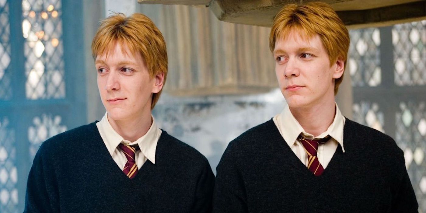 Fred and George Weasley, played by James and Oliver Phelps, smirking in Harry Potter and the Order of the Phoenix